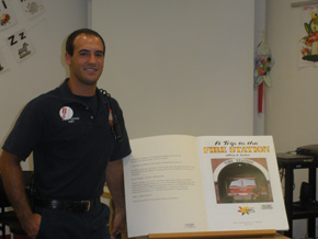 Firefighters read books to children during storytime
